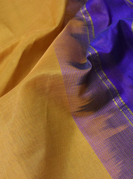 Silk cotton saree mustard shade and blue with plain body and zari woven border