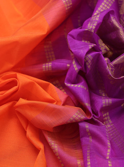 Silk cotton saree orange and purple with plain body and zari woven border