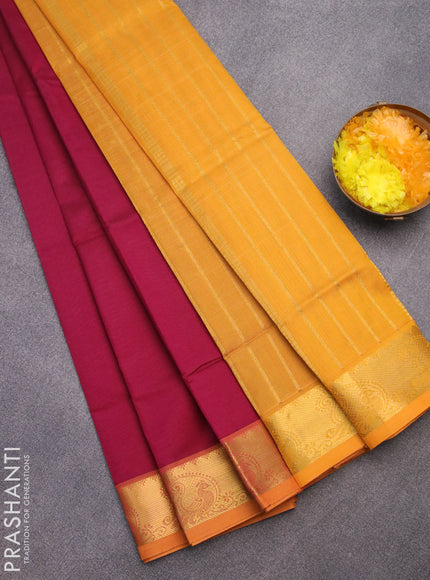 Silk cotton saree dark magenta pink and mustard yellow with plain body and zari woven border