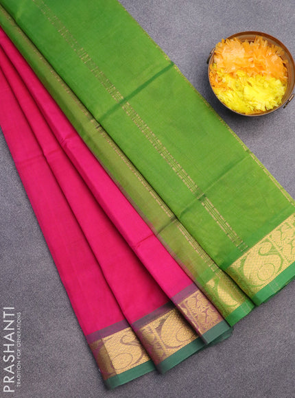 Silk cotton saree pink and light green with plain body and paisley zari woven border