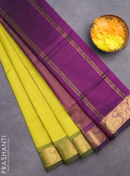 Silk cotton saree light green and purple with plain body and paisley zari woven border