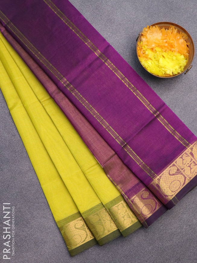 Silk cotton saree light green and purple with plain body and paisley zari woven border