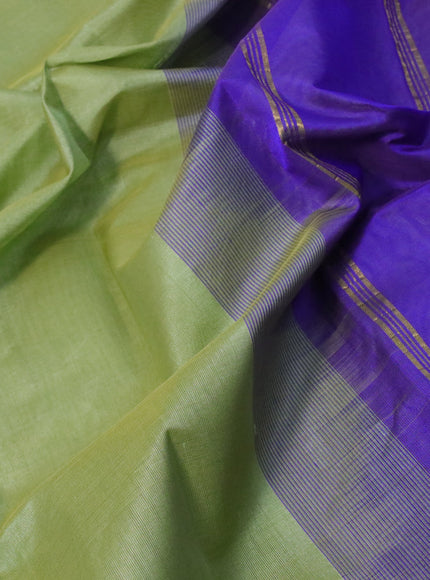 Silk cotton saree pastel green and blue with plain body and paisley zari woven border