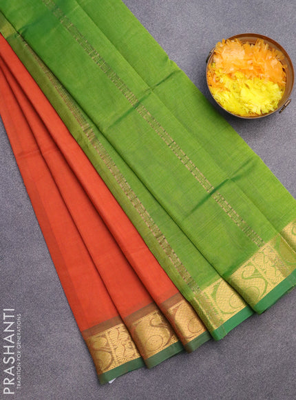 Silk cotton saree orange and green with plain body and paisley zari woven border