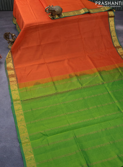 Silk cotton saree orange and green with plain body and paisley zari woven border