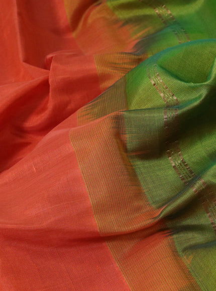 Silk cotton saree orange and green with plain body and paisley zari woven border