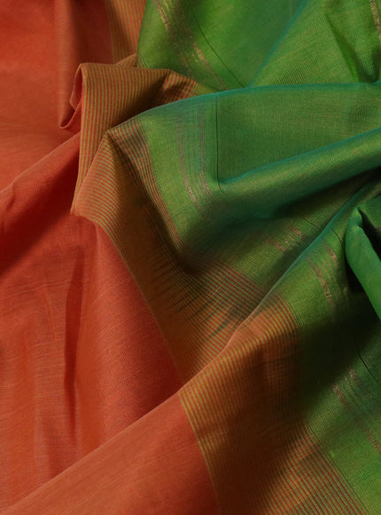 Silk cotton saree orange and green with plain body and paisley zari woven border