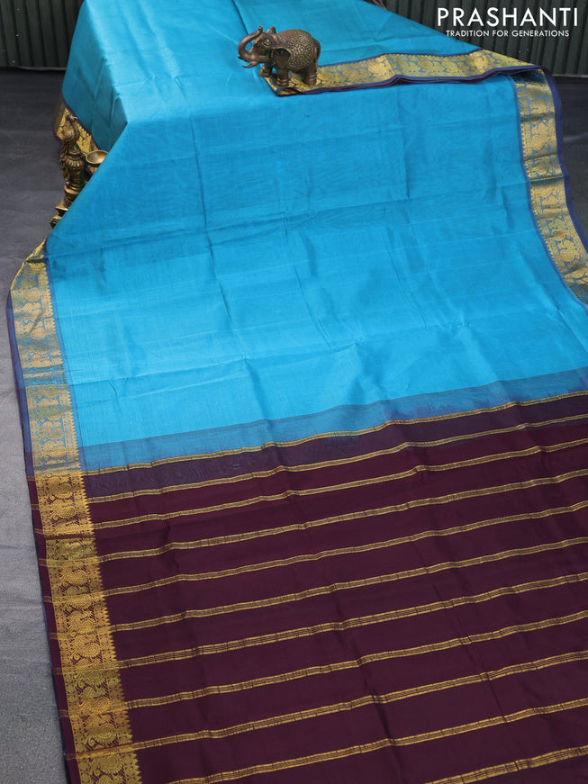 Silk cotton saree light blue and deep coffee brown with plain body and annam zari woven border