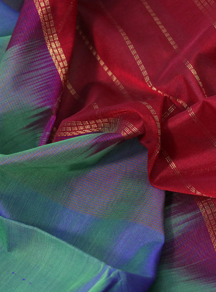 Silk cotton saree dual shade of bluish green and maroon with plain body and annam zari woven border