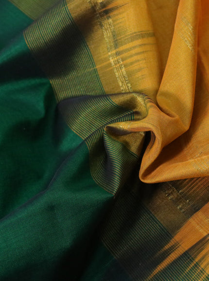 Silk cotton saree green and mustard yellow with plain body and rudhraksha zari woven border