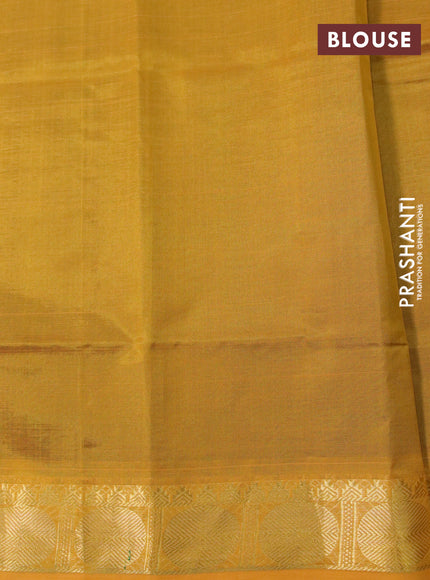 Silk cotton saree green and mustard yellow with plain body and rudhraksha zari woven border