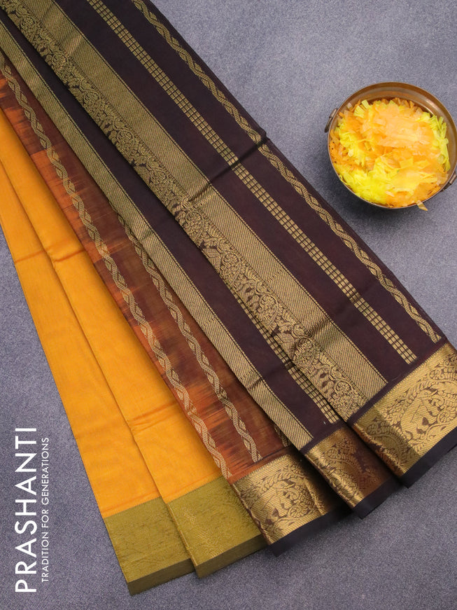 Silk cotton saree mango yellow and coffee brown with plain body and zari woven border