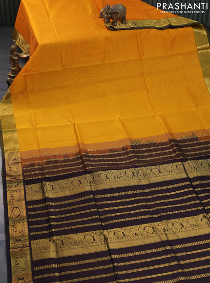 Silk cotton saree mango yellow and coffee brown with plain body and zari woven border