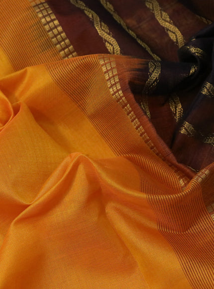 Silk cotton saree mango yellow and coffee brown with plain body and zari woven border