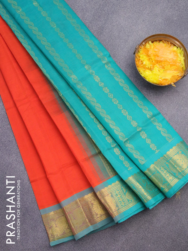 Silk cotton saree orange and teal green with plain body and annam zari woven border