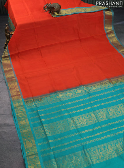 Silk cotton saree orange and teal green with plain body and annam zari woven border