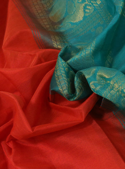 Silk cotton saree orange and teal green with plain body and annam zari woven border