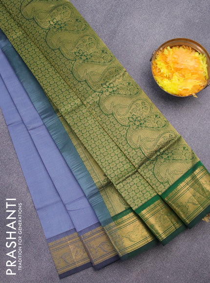 Silk cotton saree grey and green with plain body and zari woven border