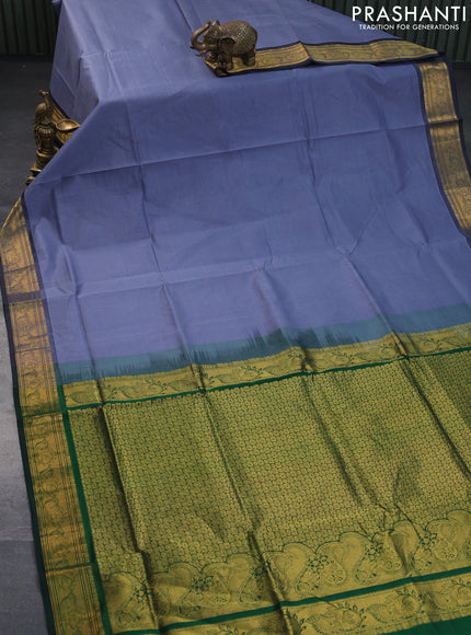 Silk cotton saree grey and green with plain body and zari woven border