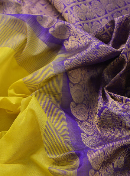 Silk cotton saree lime yellow and blue with plain body and zari woven border