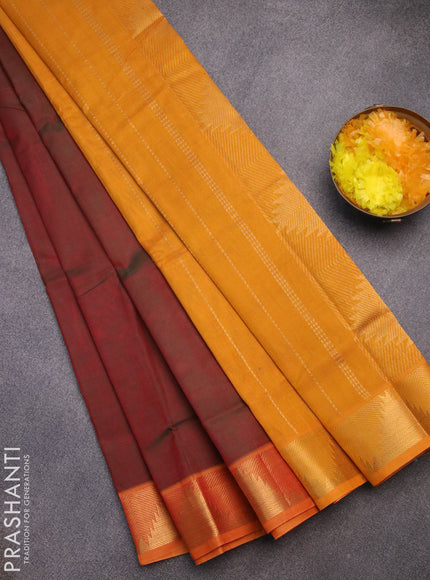 Silk cotton saree dual shade of maroonish green and mango yellow with plain body and temple design zari woven border