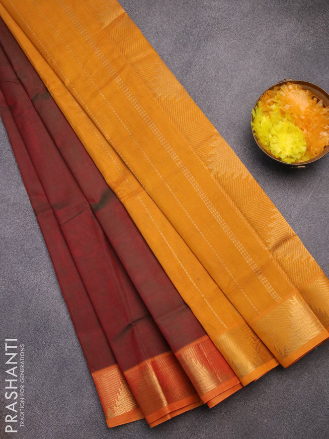 Silk cotton saree dual shade of maroonish green and mango yellow with plain body and temple design zari woven border