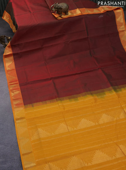 Silk cotton saree dual shade of maroonish green and mango yellow with plain body and temple design zari woven border