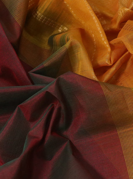 Silk cotton saree dual shade of maroonish green and mango yellow with plain body and temple design zari woven border