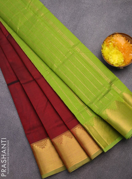 Silk cotton saree maroon and light green with plain body and temple design zari woven border