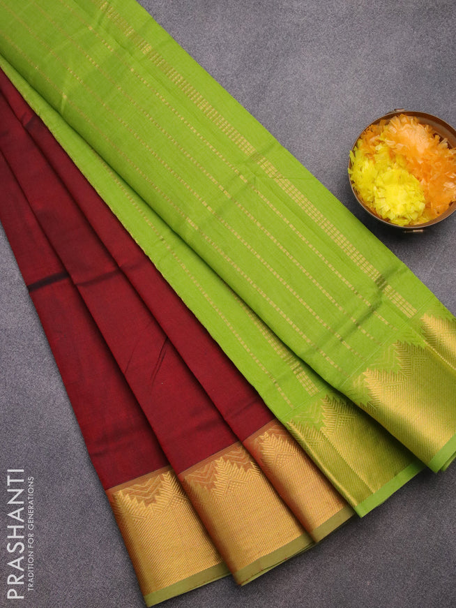 Silk cotton saree maroon and light green with plain body and temple design zari woven border