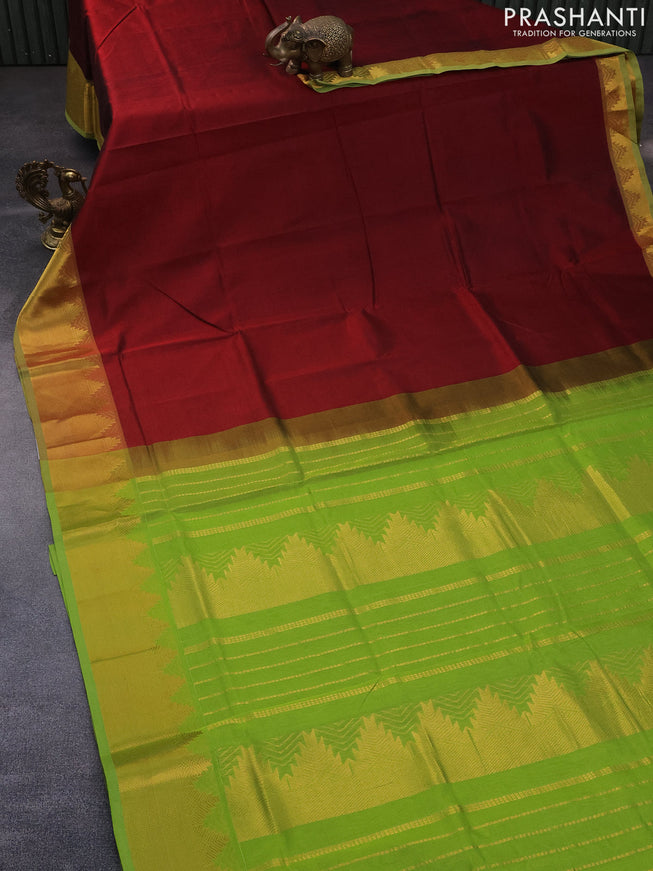 Silk cotton saree maroon and light green with plain body and temple design zari woven border