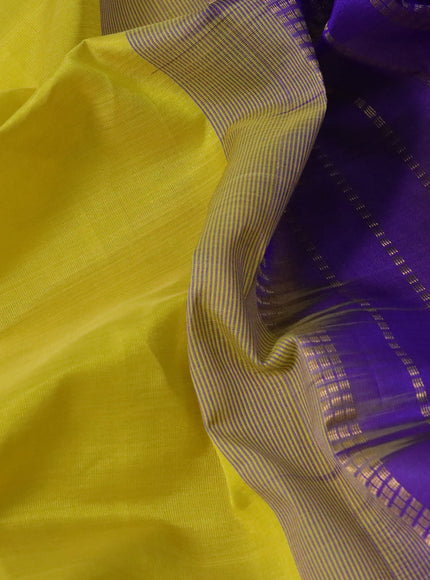 Silk cotton saree lime yellow and violet with plain body and temple design zari woven border