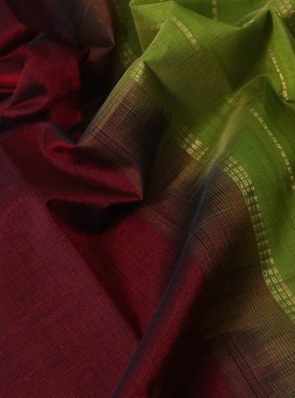 Silk cotton saree maroon and light green with plain body and temple design zari woven border