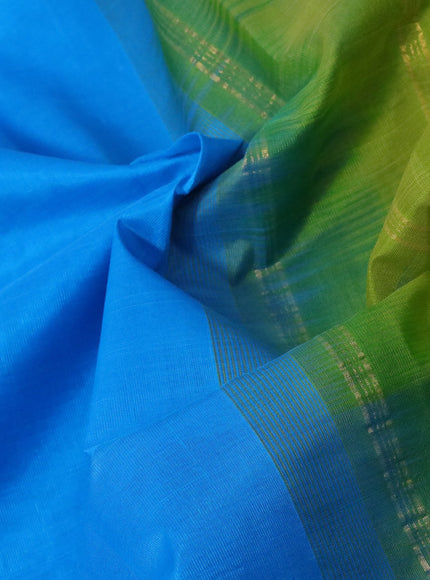 Silk cotton saree light blue and light green with plain body and zari woven simple border