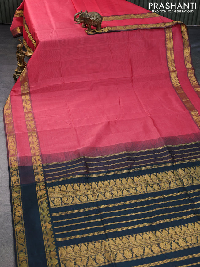 Silk cotton saree peach pink and bottle green with plain body and rettapet zari woven border