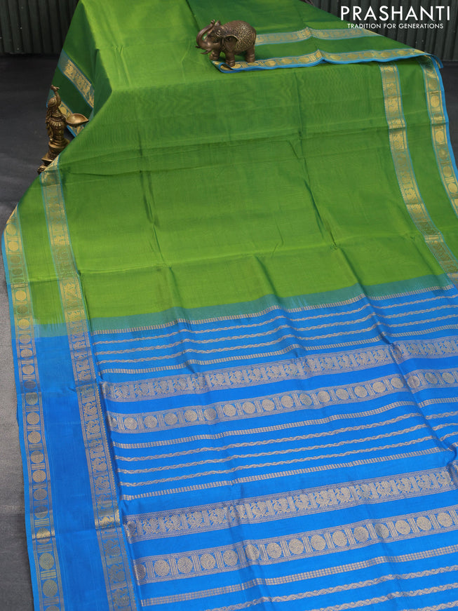 Silk cotton saree light green and cs blue with plain body and rettapet zari woven border