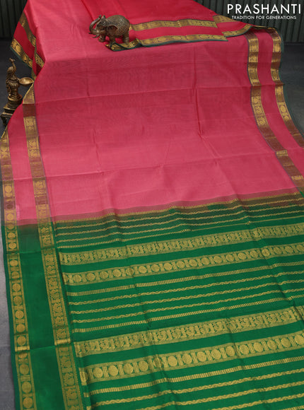 Silk cotton saree peach pink and green with plain body and rettapet zari woven border