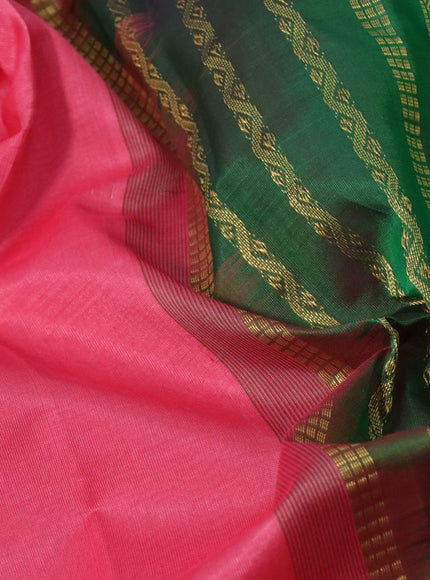 Silk cotton saree peach pink and green with plain body and rettapet zari woven border