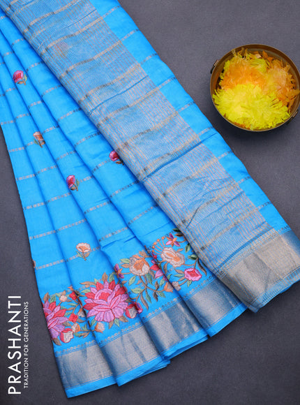 Assam silk saree light blue with allover zari weaves & embroidery work buttas and floral design embroidery work zari border