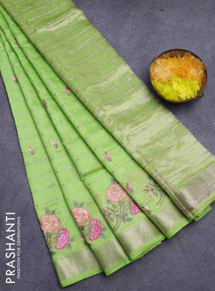 Assam silk saree fluorescent green with allover zari weaves & embroidery work buttas and floral design embroidery work zari border