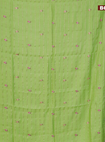 Assam silk saree fluorescent green with allover zari weaves & embroidery work buttas and floral design embroidery work zari border