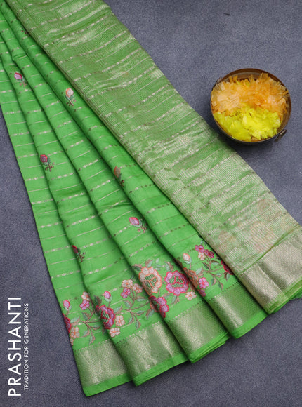 Assam silk saree parrot green with allover zari weaves & embroidery work buttas and floral design embroidery work zari border