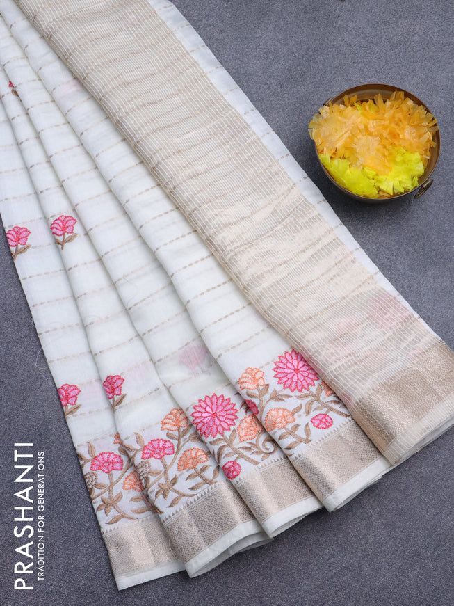 Assam silk saree off white with allover zari weaves & embroidery work buttas and floral design embroidery work zari border