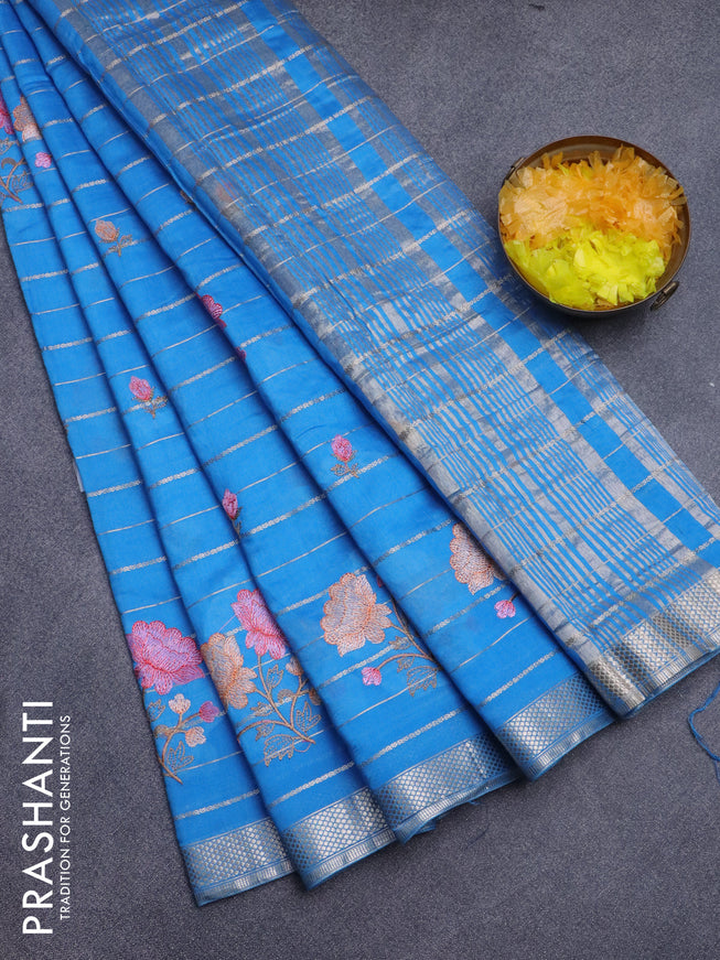 Assam silk saree cs blue with allover zari weaves & embroidery work buttas and zari woven border