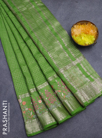 Assam silk saree light green with allover zari checked pattern and floral design embroidery work zari border