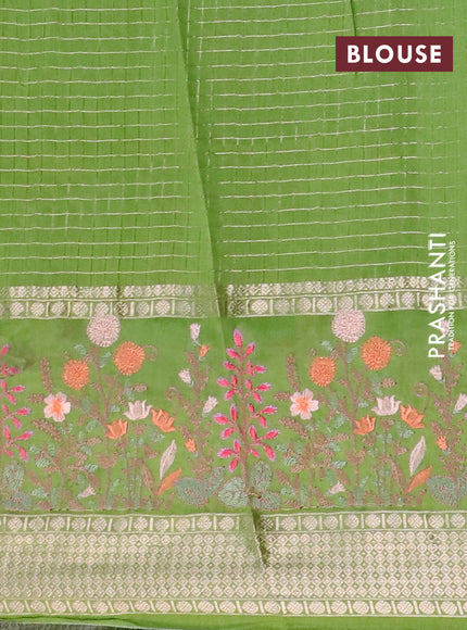 Assam silk saree light green with allover zari checked pattern and floral design embroidery work zari border