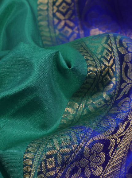 Pure kanchipuram silk saree green and royal blue with paisley & temple zari woven buttas in borderless style & aari work blouse