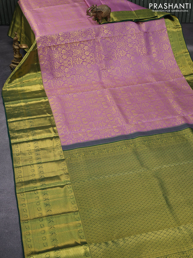 Pure kanchipuram silk saree mild purple and green with allover zari woven brocade weaves and long zari woven border & aari work blouse