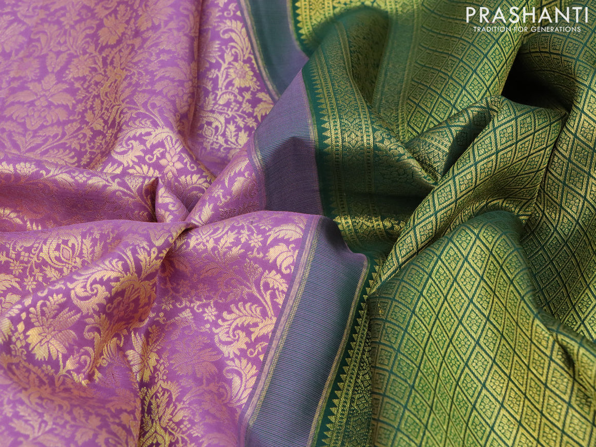 Pure kanchipuram silk saree mild purple and green with allover zari woven brocade weaves and long zari woven border & aari work blouse