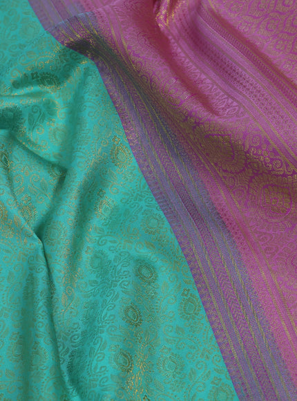 Pure kanchipuram silk saree teal blue shade and light pink with allover zari woven brocade weaves and zari woven border & aari work blouse